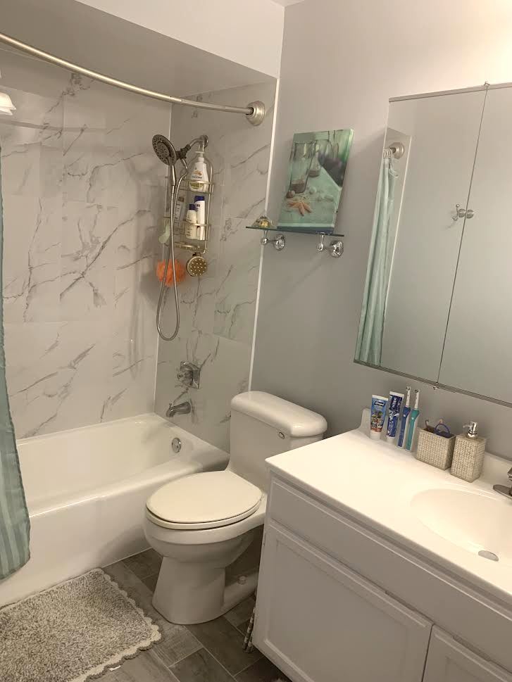 810 North River Road, Unit 3C Mount Prospect, IL 60056 - Photo 19 of 21 a bathroom with a toilet sink and shower