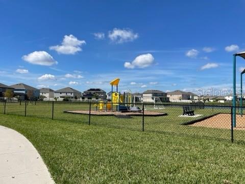 9610 Rally Spring Loop Wesley Chapel, FL 33545 - Photo 33 of 38 a view of a garden with a slide