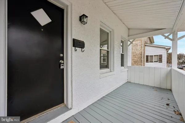 a view of an entryway with wooden floor