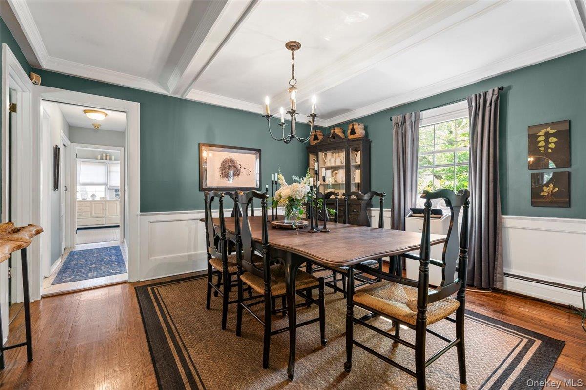 10 Rancher Place Huntington, NY 11743 - Photo 5 of 44 Dining room featuring hardwood flooring and white wainscoting