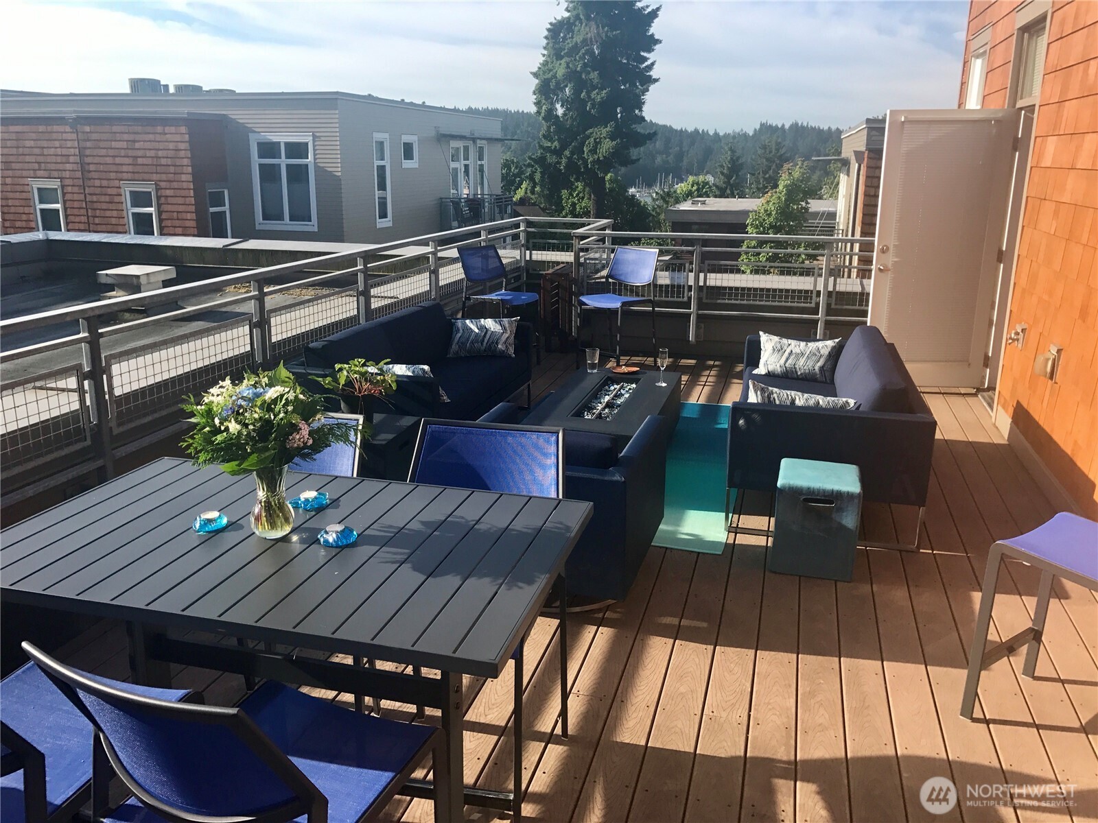 132 Harbor Square Loop Northeast, Unit H02 Bainbridge Island, WA 98110 - Photo 2 of 3 a view of roof deck with patio