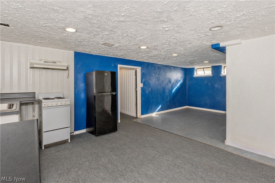 5659 Shawnee Road Lyndhurst, OH 44124 - Photo 22 of 33 Lower level recreation room w/ kitchenette