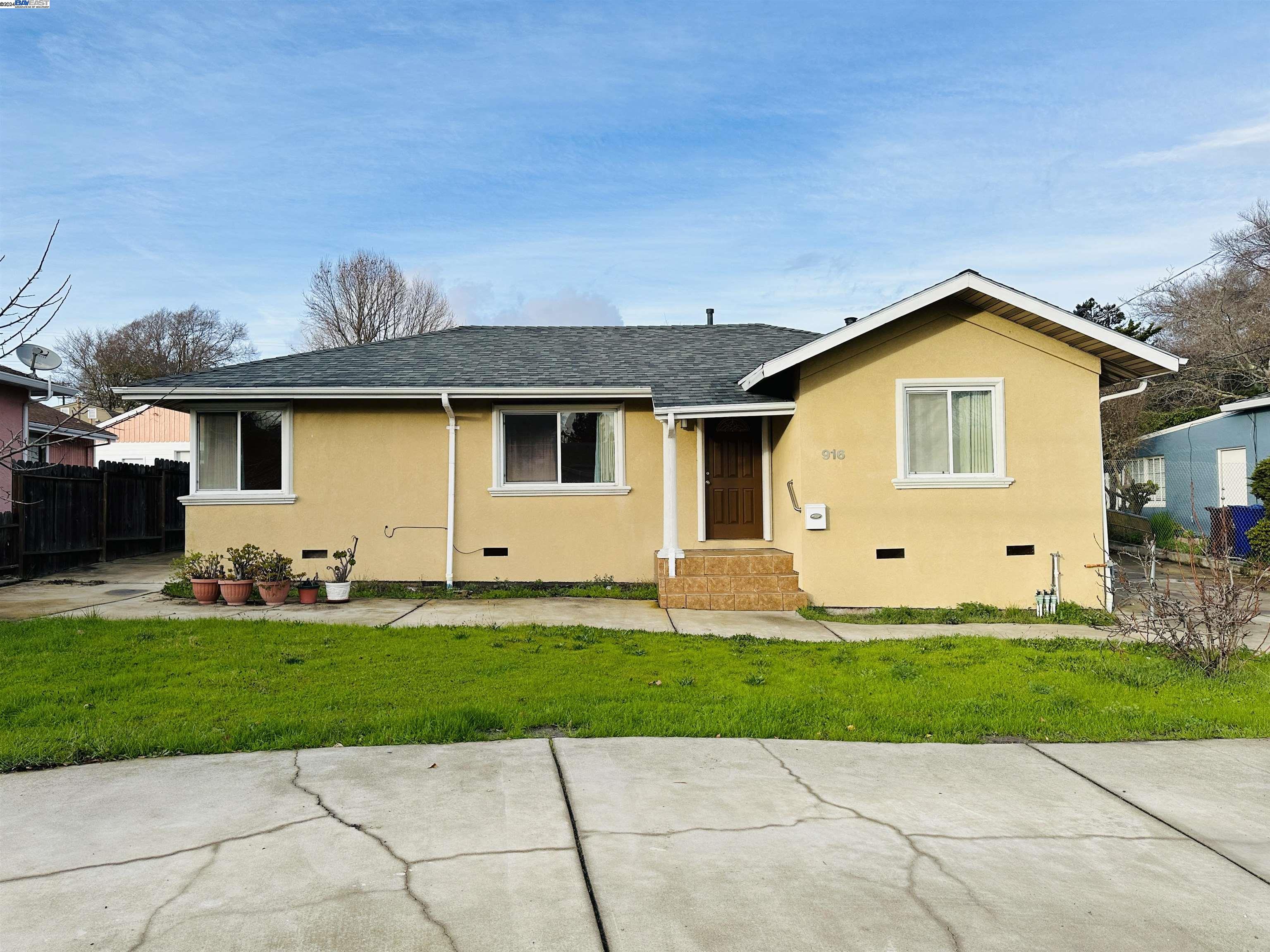 916 Manor Road El Sobrante, CA 94803 - Photo 1 of 1 a front view of a house with a yard and garage