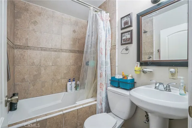 a bedroom with bed and a window