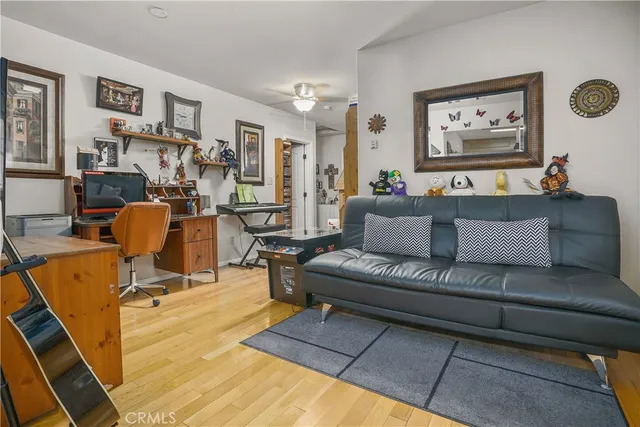 a living room with furniture and flat screen tv