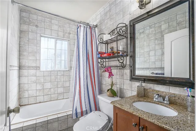 a kitchen with stainless steel appliances granite countertop a stove and a wooden floors