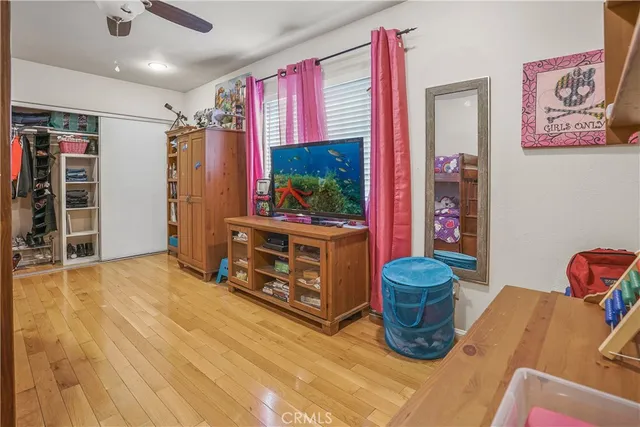 a bedroom with bed and window