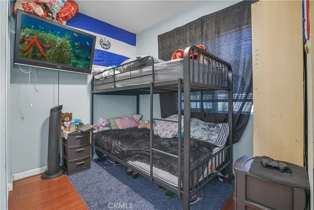 a bathroom with a sink toilet and a mirror