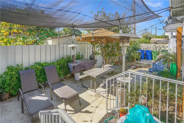 a front view of a house with outdoor seating