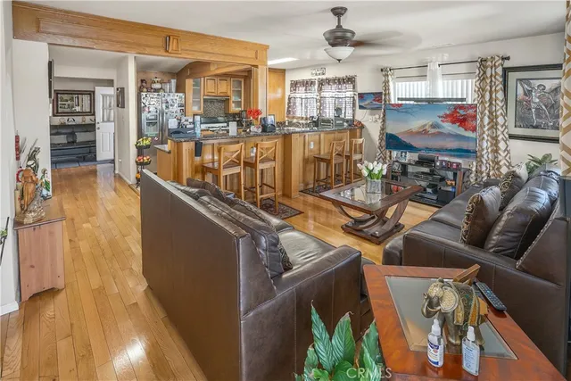 a view of a living room with furniture and a floor to ceiling window