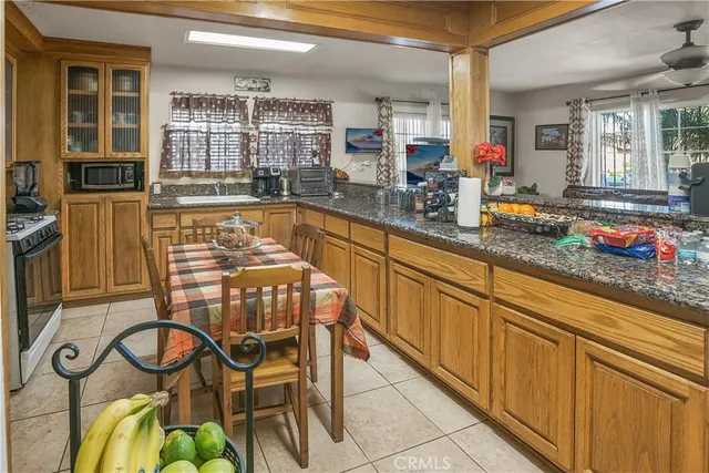 a kitchen with a sink and wooden cabinets