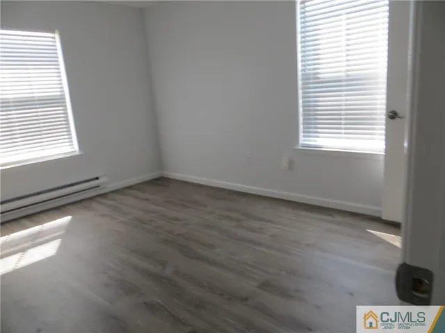 a view of an empty room and a window