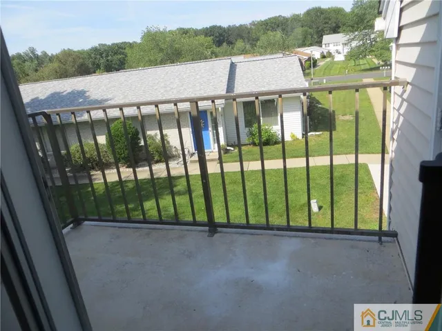 a bathroom with a sink a mirror a toilet and shower