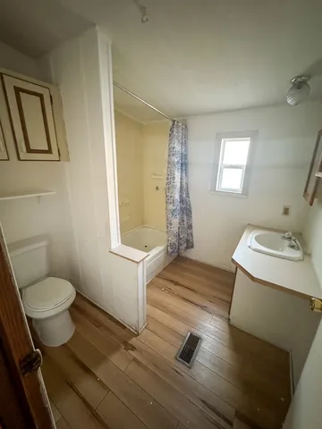 a bathroom with a sink toilet and vanity