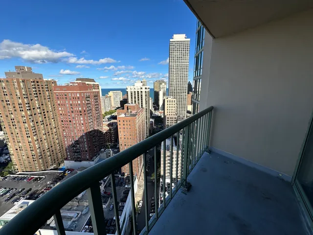 a view of a balcony with city view