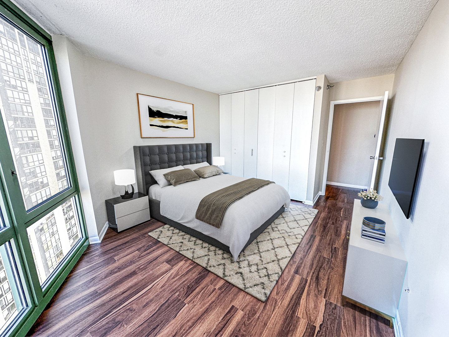 111 West Maple Street, Unit 2703 Chicago, IL 60610 - Photo 8 of 14 a bedroom with a bed and a flat screen tv