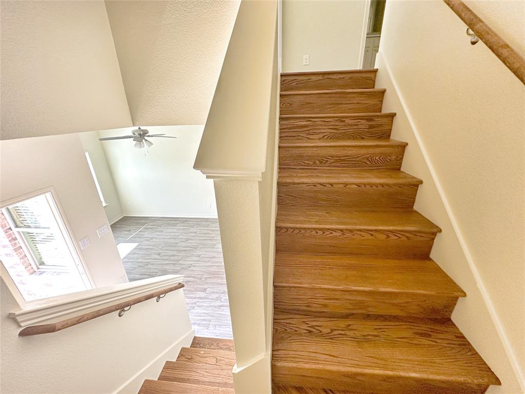 1709 St Louis Avenue Fort Worth, TX 76110 - Photo 5 of 19 Unfurnished bedroom featuring light colored carpet, a closet, and ceiling fan