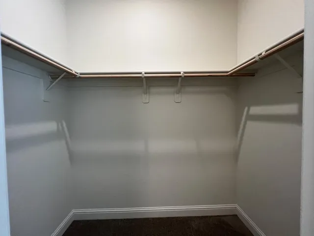 a view of an empty walk in closet