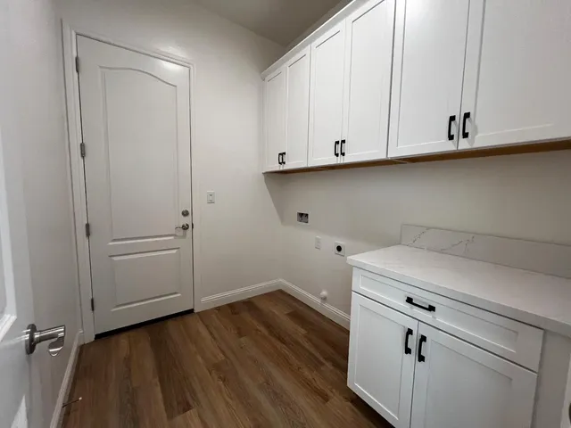 a view of cabinets and wooden floor