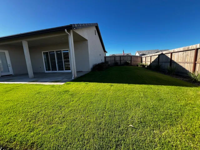 a view of a back yard of the house