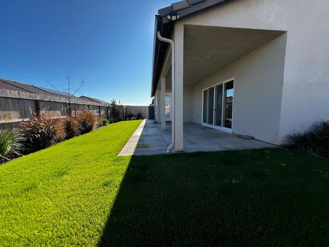 a view of a backyard with garden
