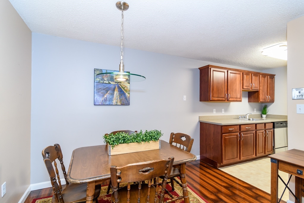 46 Silver Hill Lane, Unit 1 Natick, MA 01760 - Photo 7 of 11 a view of a dining room with furniture