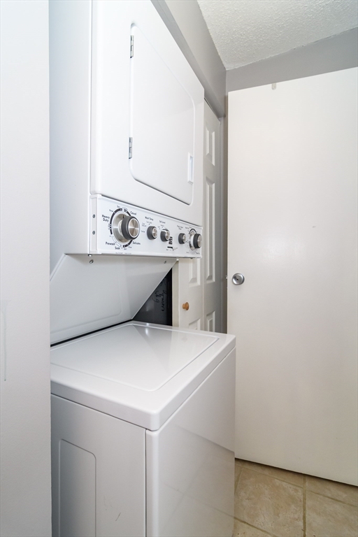 46 Silver Hill Lane, Unit 1 Natick, MA 01760 - Photo 9 of 11 a utility room with washer and dryer