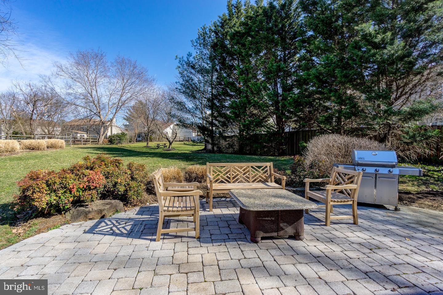 13351 Point Rider Lane Herndon, VA 20171 - Photo 37 of 39 Large stone patio with extensive landscaping