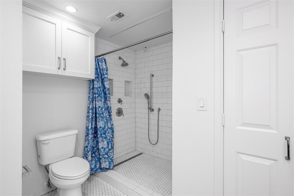 2601 Preston Road, Unit 6108 Plano, TX 75093 - Photo 20 of 26 a bathroom with a shower and a toilet