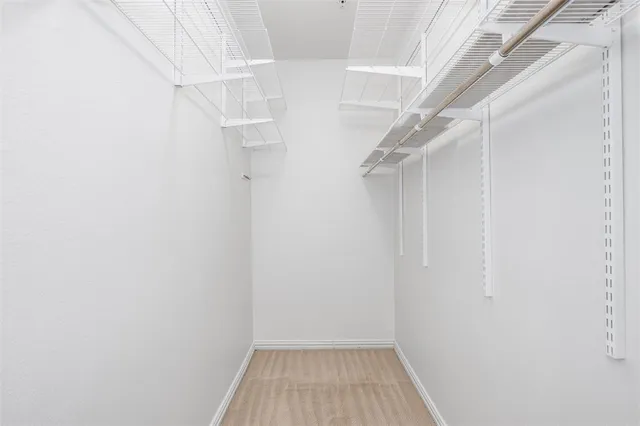 a view of a room with wooden walls