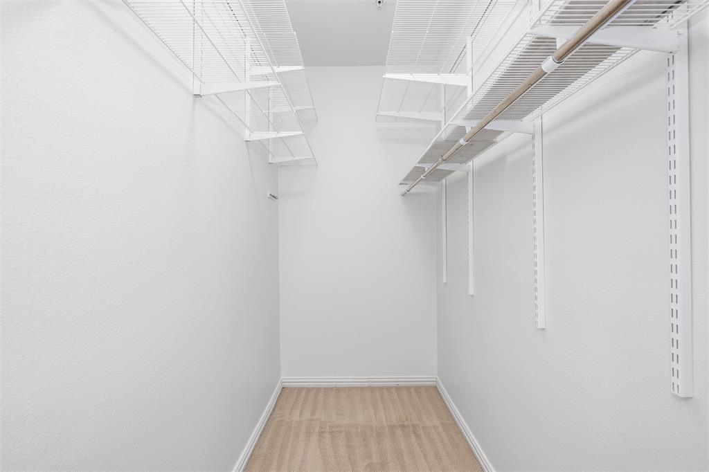 2601 Preston Road, Unit 6108 Plano, TX 75093 - Photo 21 of 26 a view of a room with racks on the wall