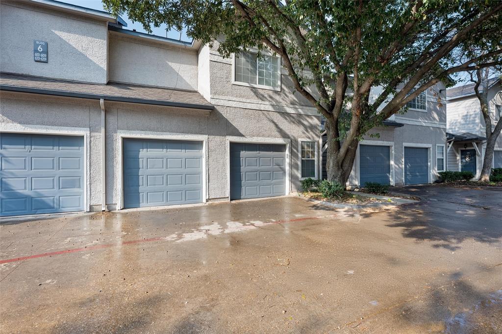 2601 Preston Road, Unit 6108 Plano, TX 75093 - Photo 26 of 26 a front view of a house with a yard and garage