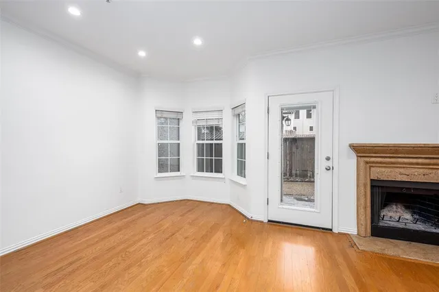 a view of empty room with a fireplace