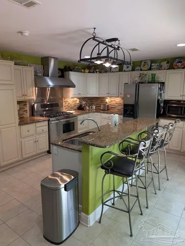 a kitchen with counter top space cabinets and stainless steel appliances