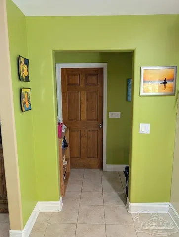 a view of a hallway with a yellow space
