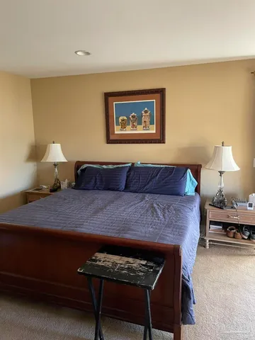 a living room with furniture and a lamp