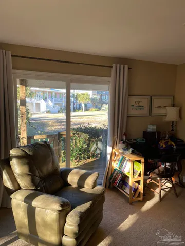 a room with gym equipment and large windows