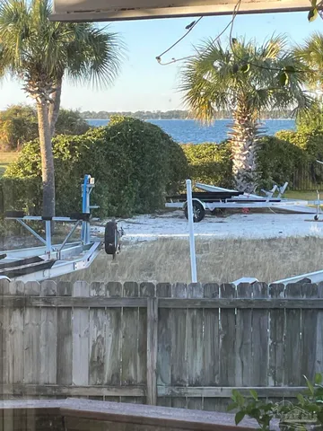 a view of a swimming pool with a yard