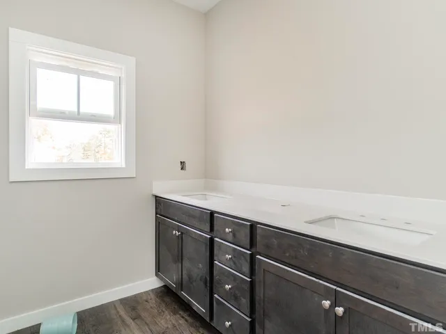 a view of storage and utility room with window