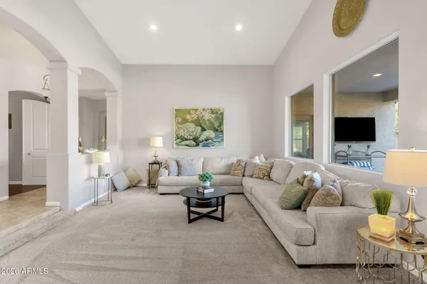 a kitchen with stainless steel appliances granite countertop wooden cabinets a stove top oven a sink and a granite counter tops