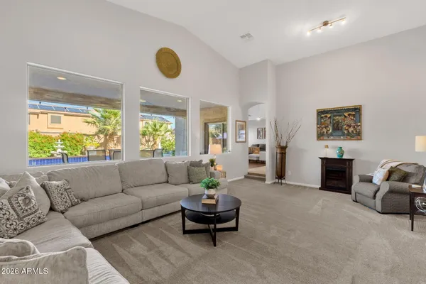 a large kitchen with a table and chairs