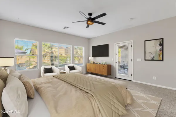 a living room with furniture a rug and a window