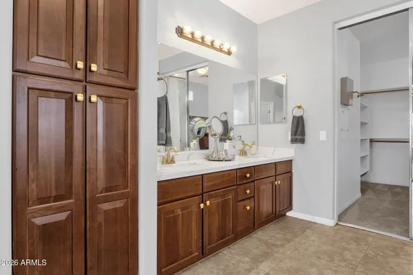 a bed room with a bed and a chair