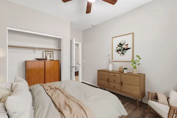 a view of a patio with chairs under an umbrella