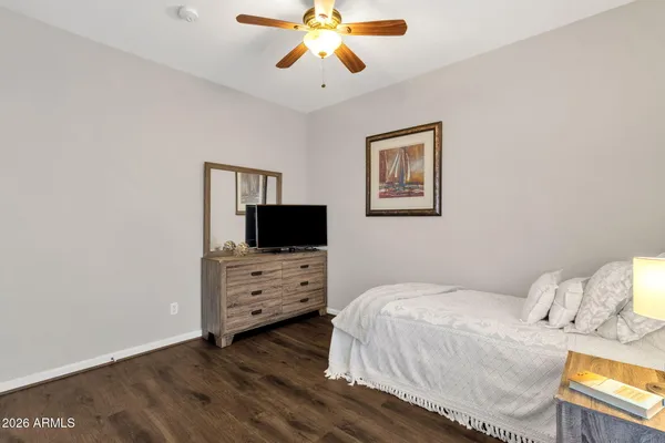 a view of a tables and chairs under an umbrella