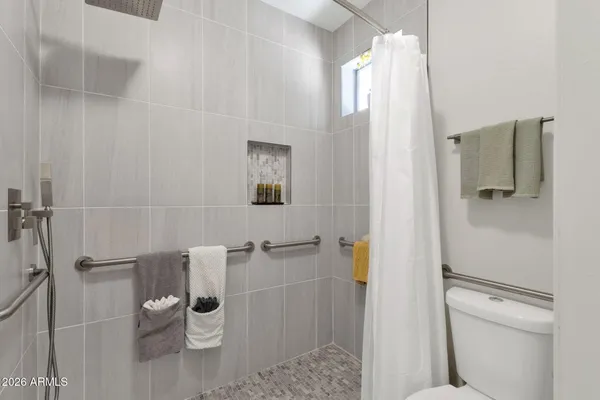 a view of a dining room with furniture and a potted plant