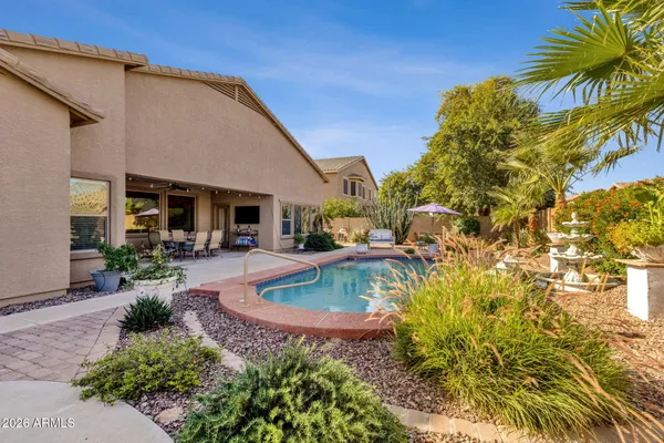 a view of a patio with a table and chairs