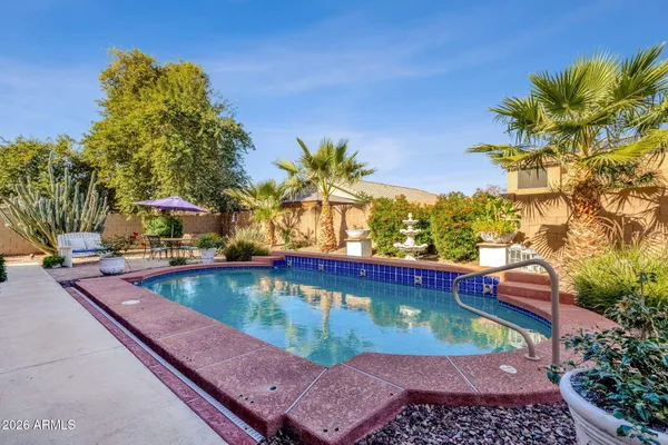 a view of a lake with boats and trees in the background