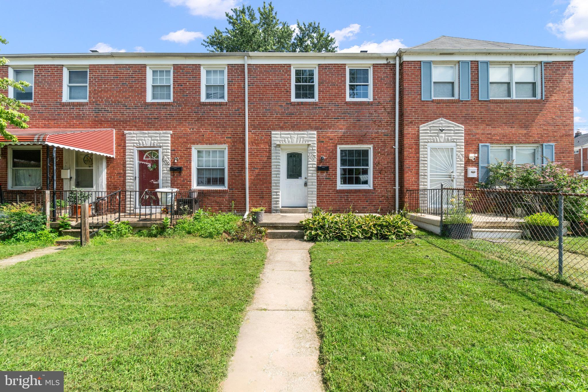 2214 Hawthorne Road Baltimore, MD 21220 - Photo 1 of 28 a front view of a house with garden and porch