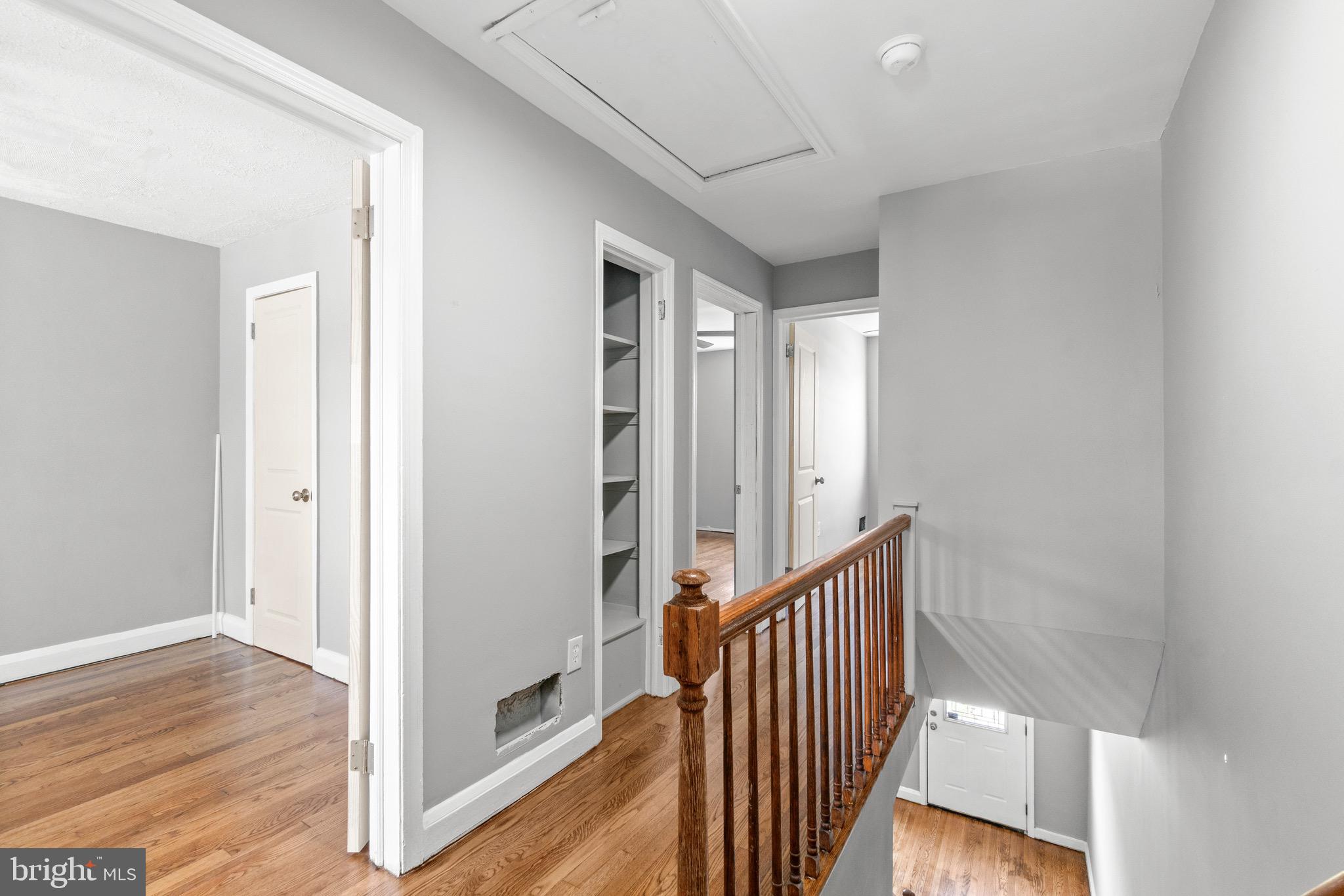 2214 Hawthorne Road Baltimore, MD 21220 - Photo 15 of 28 a view of a hallway with wooden floor and staircase